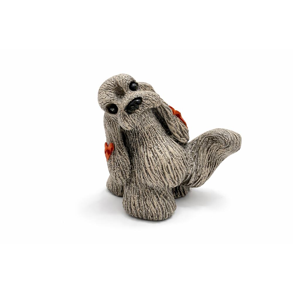 Vintage Textured Ceramic Dog Figurine with Red Bows